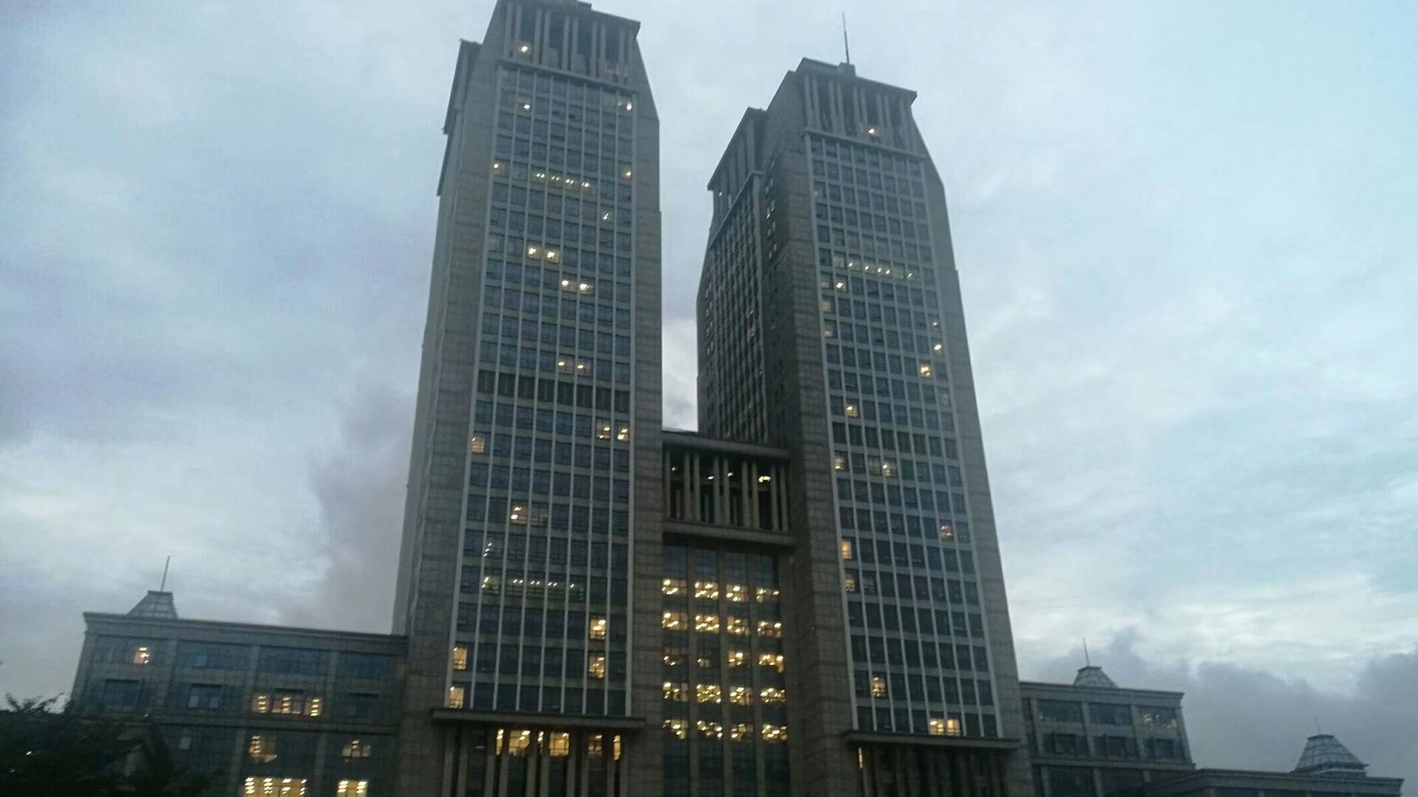 The twin towers of Guanghua Tower at Fudan University in Shanghai at dusk.